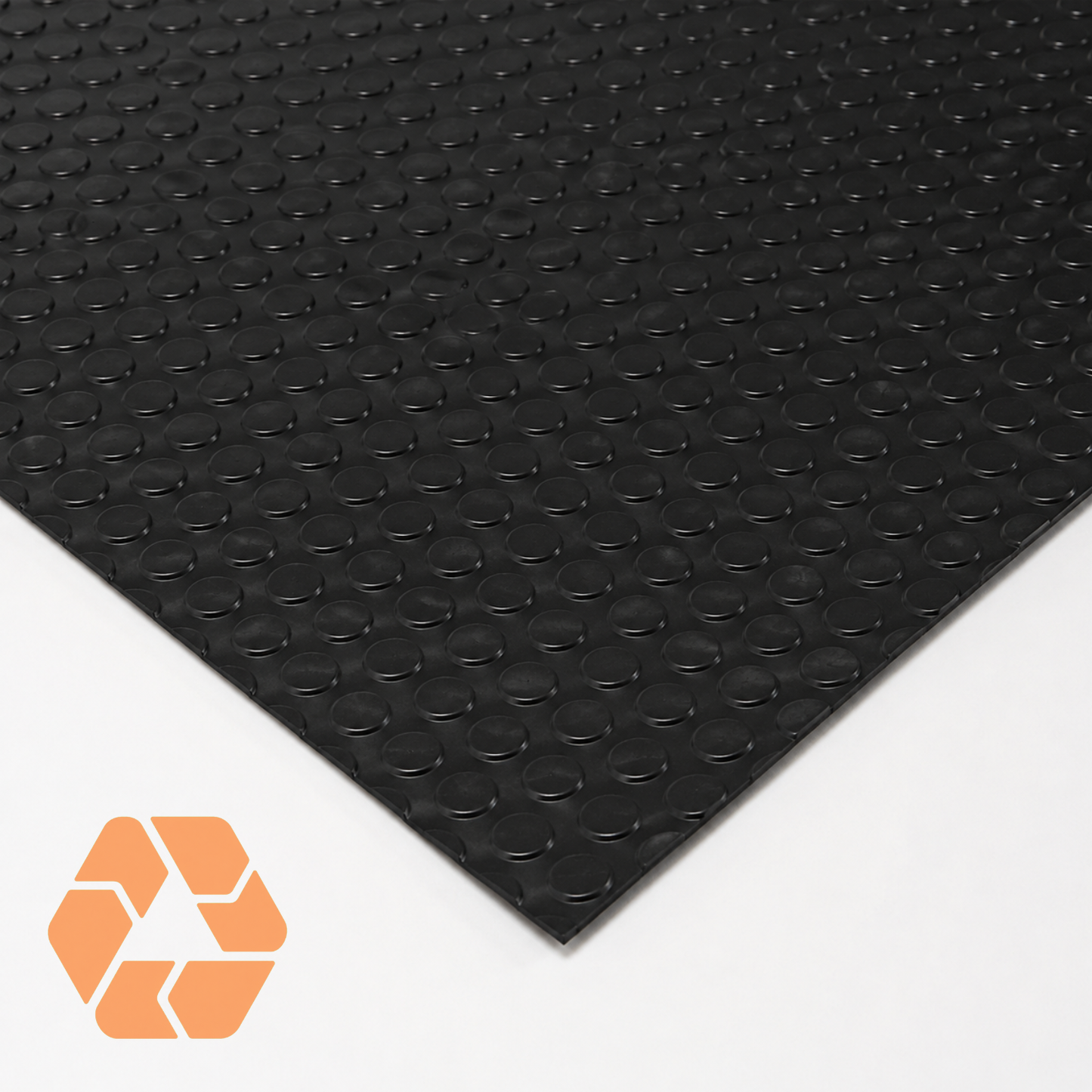 Piso de goma negro antideslizante con textura de círculos, 3mm de espesor, ideal para alto tráfico y seguridad industrial.